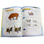 Robotis Dream instruction book open. Pages are white with a blue border in the grid shape pattern of the pieces. The pages show step-by-step instructions on creating the cow robot.