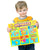 A young blonde boy holding up the Geo Puzzles box. The top of the box shows the logo with a large 6, indicating there are 6 puzzles inside. There are 6 images below of the map puzzles that are contained inside. The top row shows maps of the world, U S A with Canada, and Europe. The bottom row shows Latin America, Asia, and Africa with the Middle East. The box is orange and yellow with a variety of colors on the map images.