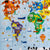 A close up of the Jumbo Puzzle, Map of the World. The map is mainly light blue with each continent a different color and many animals and vehicles placed all over the top. The visible continents and their colors are the following: North America is red, South America is purple, Africa is green, Europe is blue, and Asia is yellow.