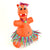 An orange hippo wearing a colorful grass skirt created from Wikki Sticks. The wax sticks are wound around and stuck to each other to create the body and grass skirt. The smiling hippo is wearing a boy and necklace, also created by the Wikki Stix.