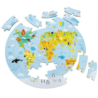 Wooden World Map Puzzle mostly put together with several pieces off to the side. The puzzle is circle shaped and the picture is of the globe with illustrations of  animals represented by their country.